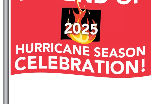 red flag with The end of Hurricane Season Celebration on it and a burn barrel in the middle
