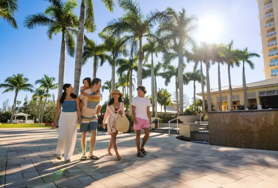 Family walking outside of Hyatt Regency Coconut Point Resort